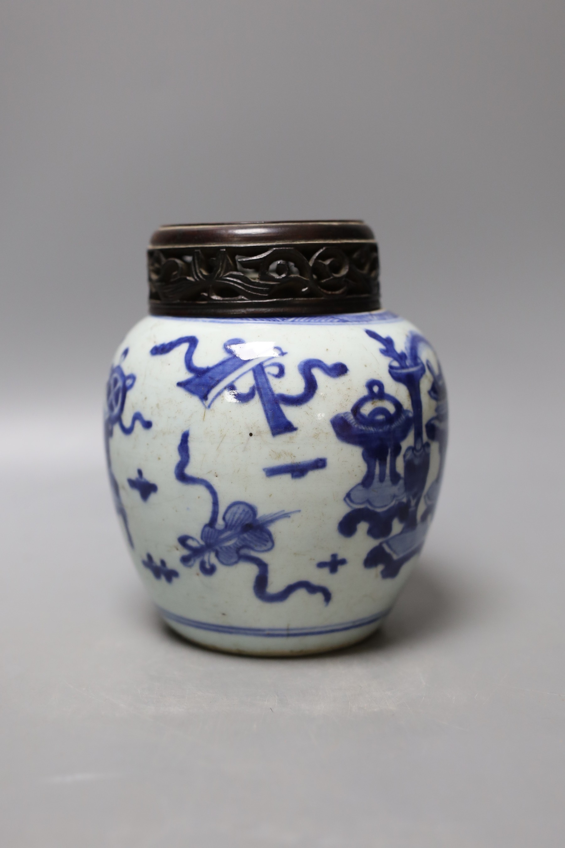 A 19th century Chinese blue and white jar with wood cover - 17cm high